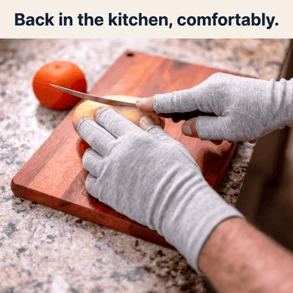 SilverWise Bamboo Compression Gloves on whilst person cuts knife in kitchen