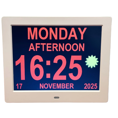 DayClock digital calendar displaying Monday, afternoon, and time 16:25 in large bright text.