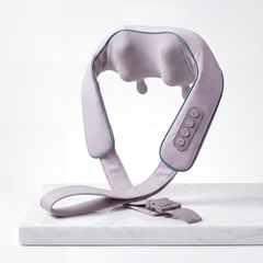 SilverWise DeepKnead neck and shoulder massager in pale grey with teal piping, on a white marble slab