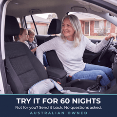 Woman turning to talk to her grandchildren in the car, with the DeepKnead 60-night money-back guarantee
